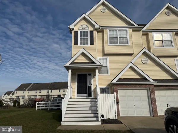 a view of front of house with a yard
