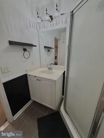 a utility room with cabinets washer and dryer