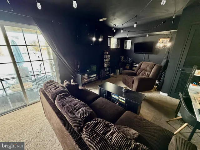 a view of a balcony with wooden floor chairs and a table