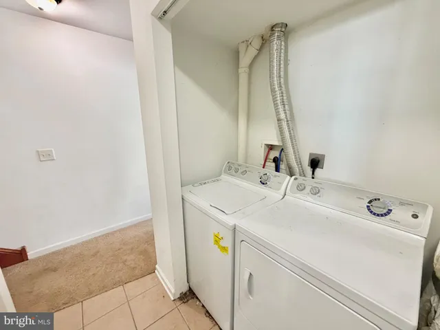a kitchen with stainless steel appliances kitchen island granite countertop a stove and a cabinets