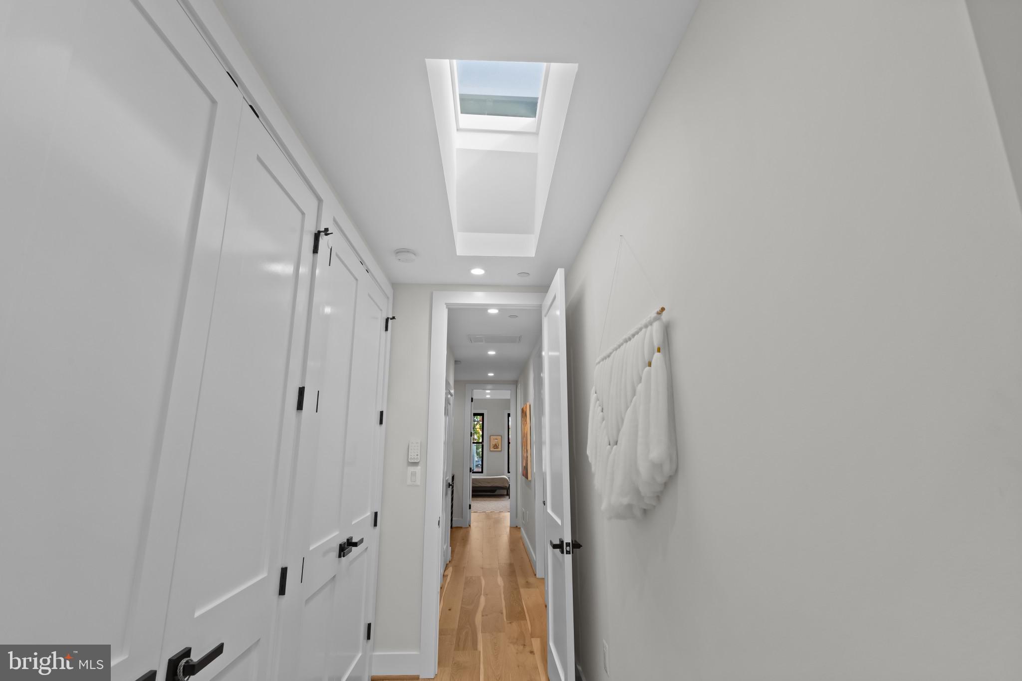 910 8th Street Northeast Washington, DC 20002 - Photo 28 of 54 Primary bedroom corridor with his and hers closets