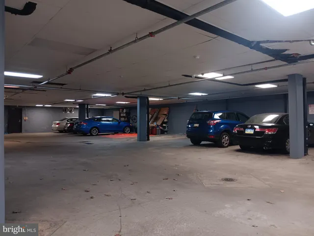 a view of a car parked in the parking area