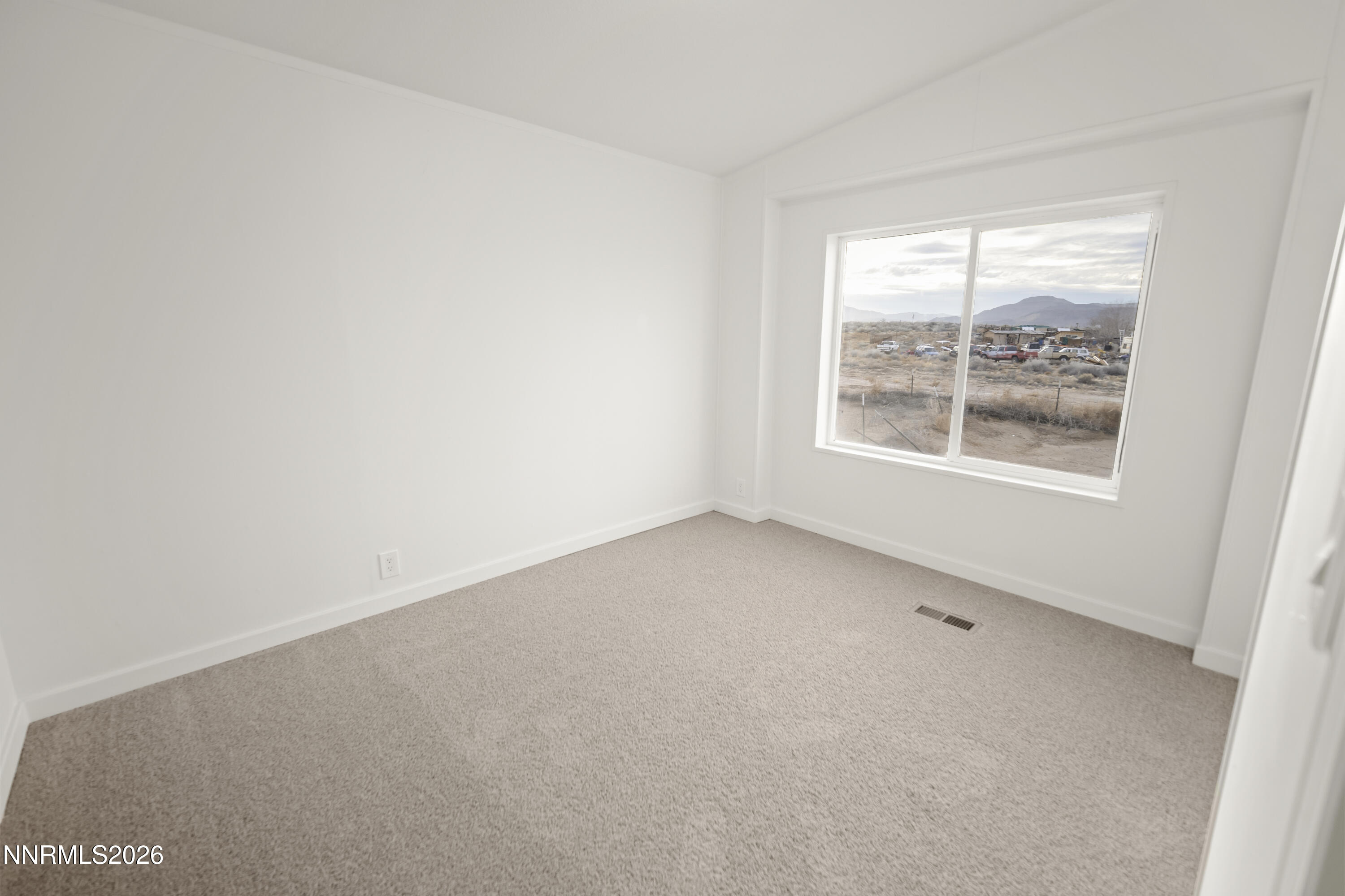 3225 Antelope Street Silver Springs, NV 89429 - Photo 16 of 39 an empty room with a window