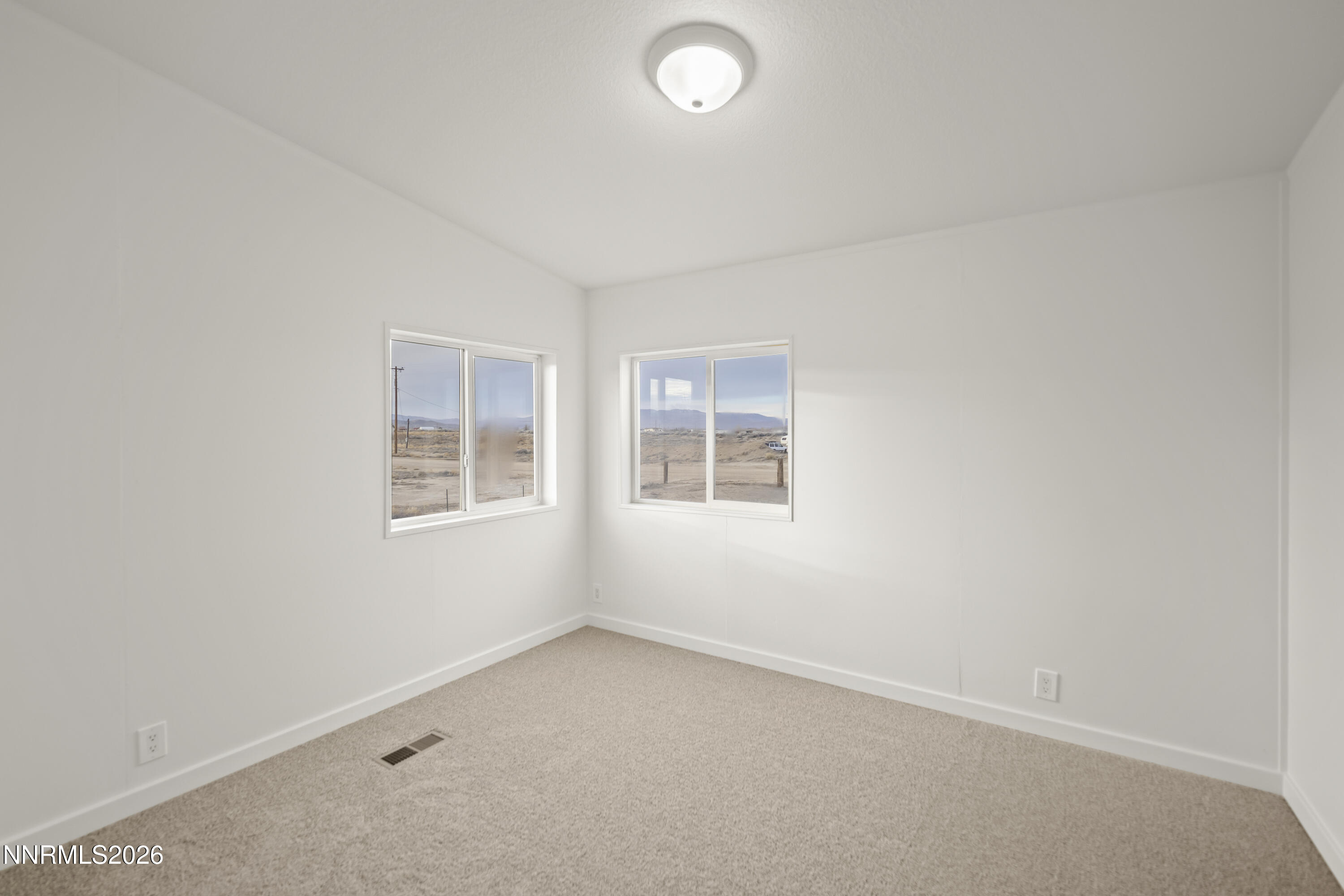 3225 Antelope Street Silver Springs, NV 89429 - Photo 17 of 39 an empty room with a window