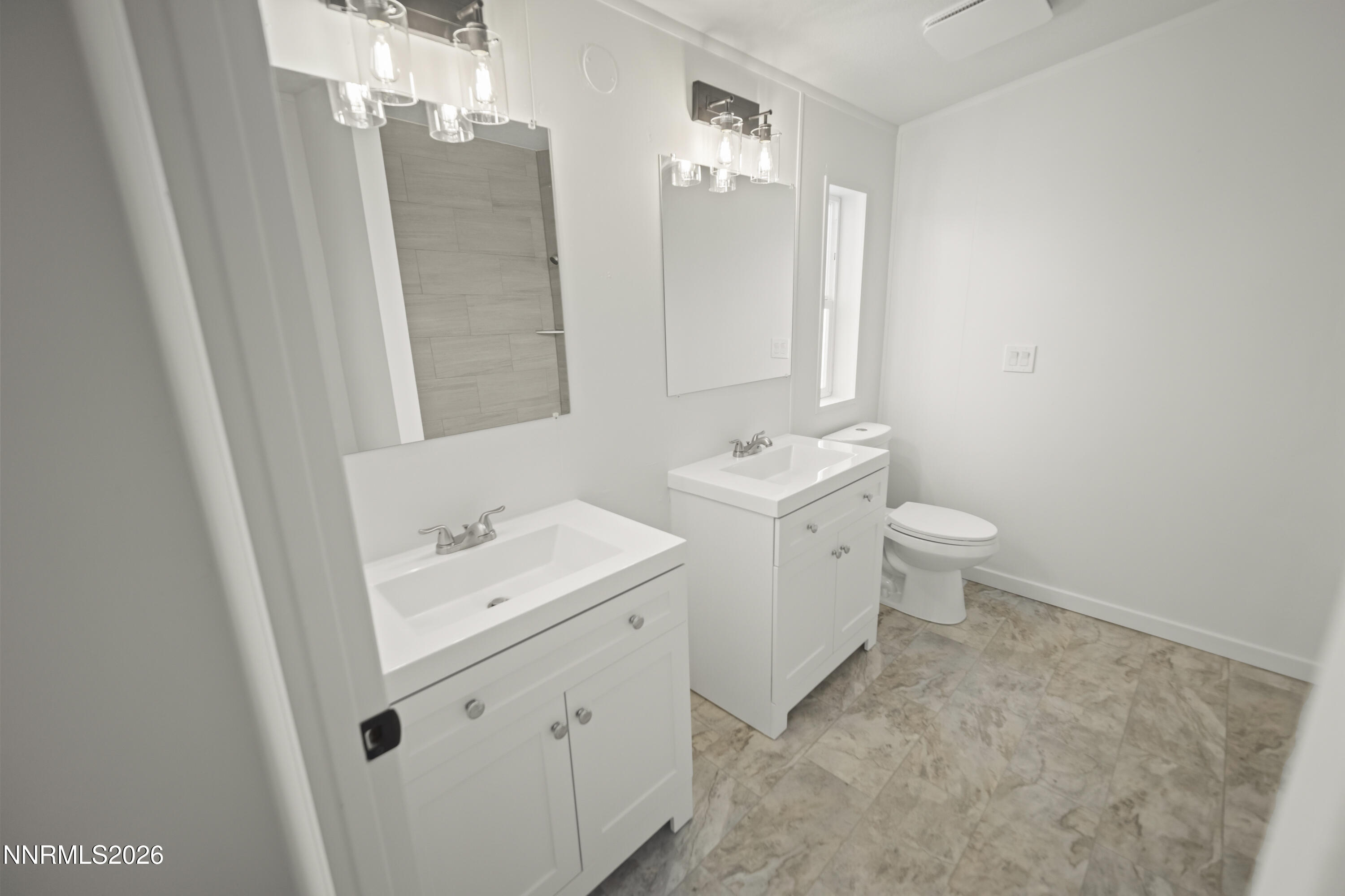 3225 Antelope Street Silver Springs, NV 89429 - Photo 20 of 39 a view of bathroom with a sink a toilet and a mirror