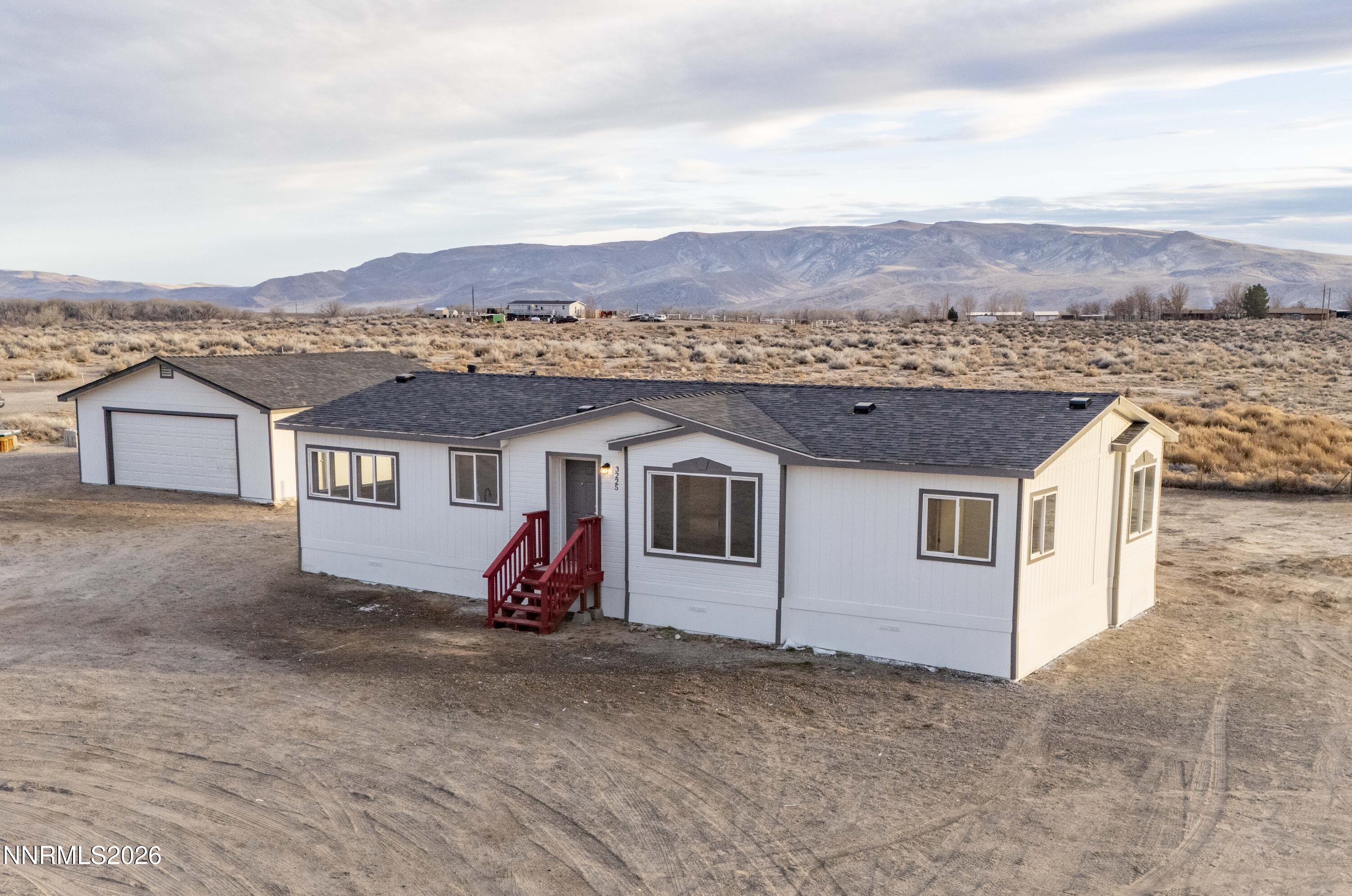 3225 Antelope Street Silver Springs, NV 89429 - Photo 2 of 39 a view of a house with a yard
