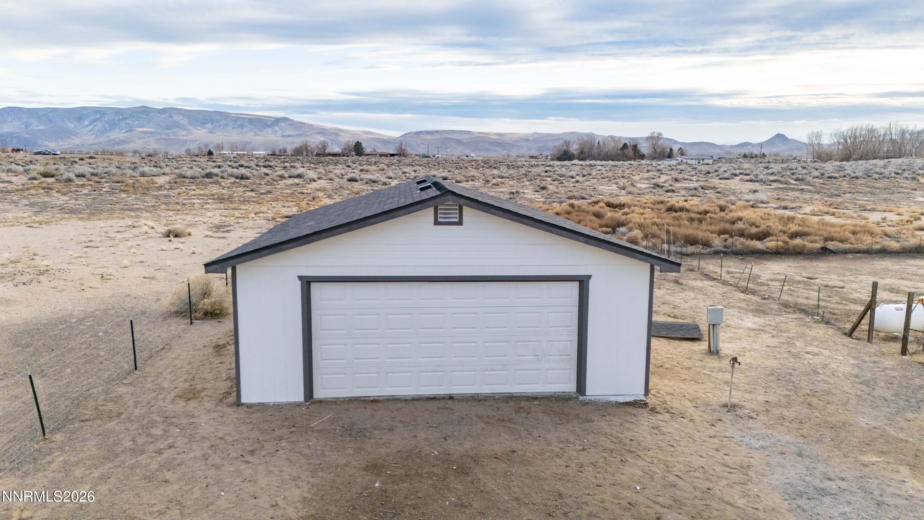 3225 Antelope Street Silver Springs, NV 89429 - Photo 38 of 39 a view of a dry yard with wooden fence