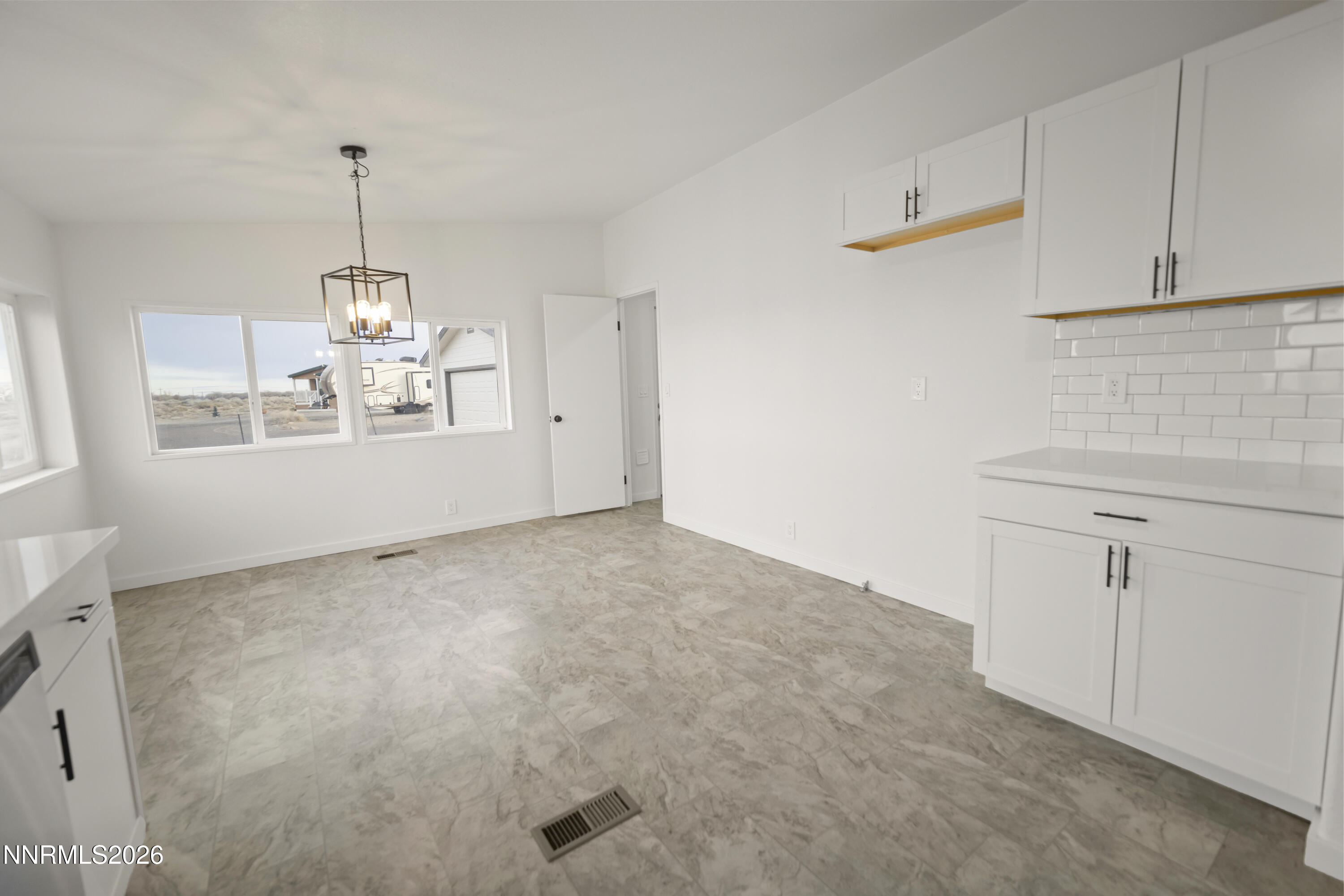 3225 Antelope Street Silver Springs, NV 89429 - Photo 4 of 39 a view of a kitchen with microwave and cabinets