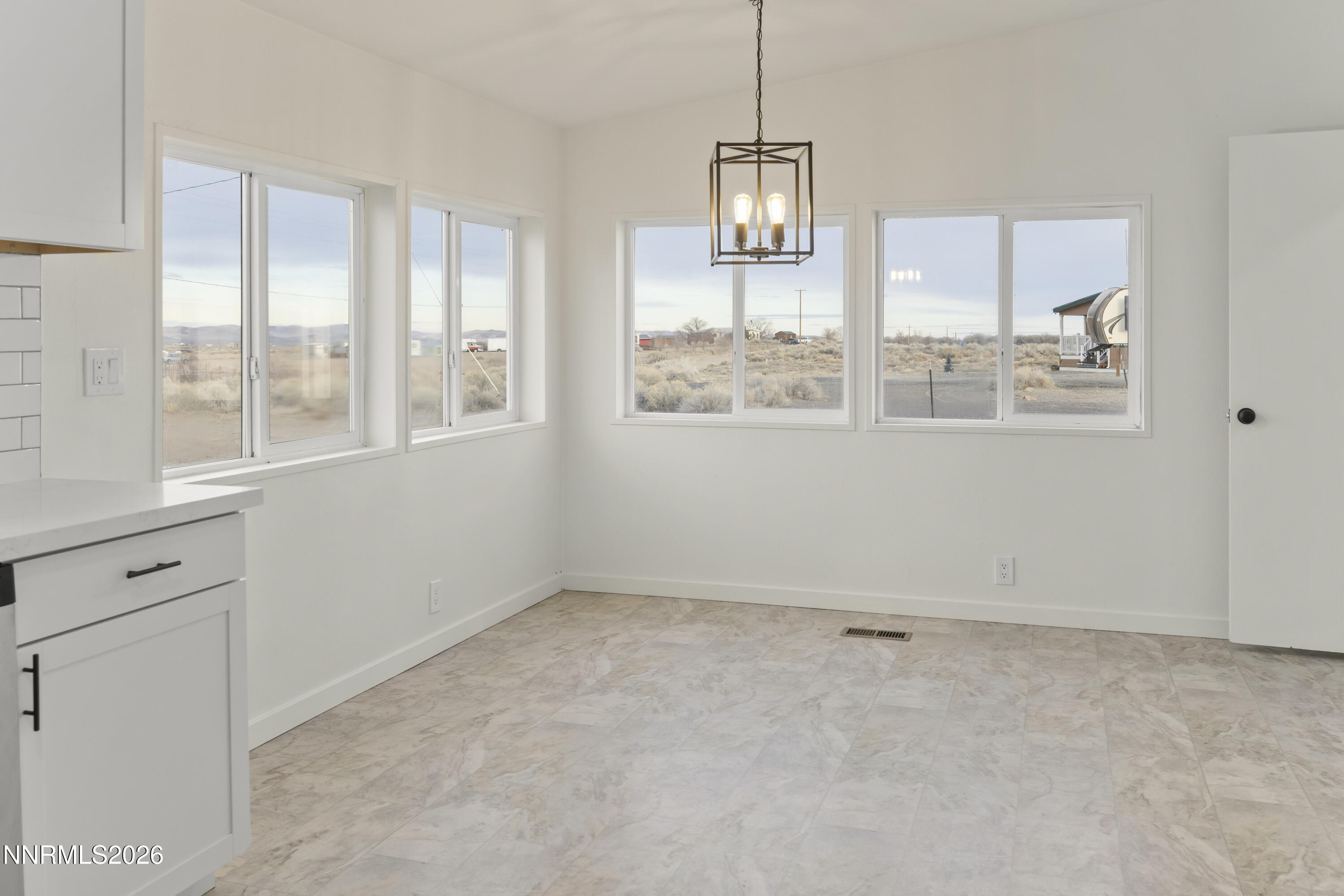 3225 Antelope Street Silver Springs, NV 89429 - Photo 6 of 39 a view of an empty room with a window