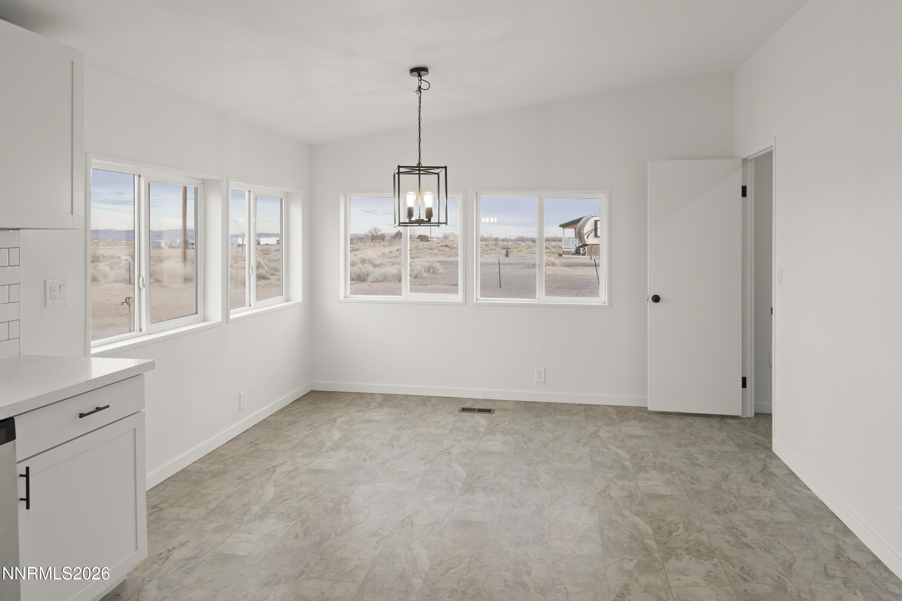 3225 Antelope Street Silver Springs, NV 89429 - Photo 8 of 39 a view of an empty room with a window
