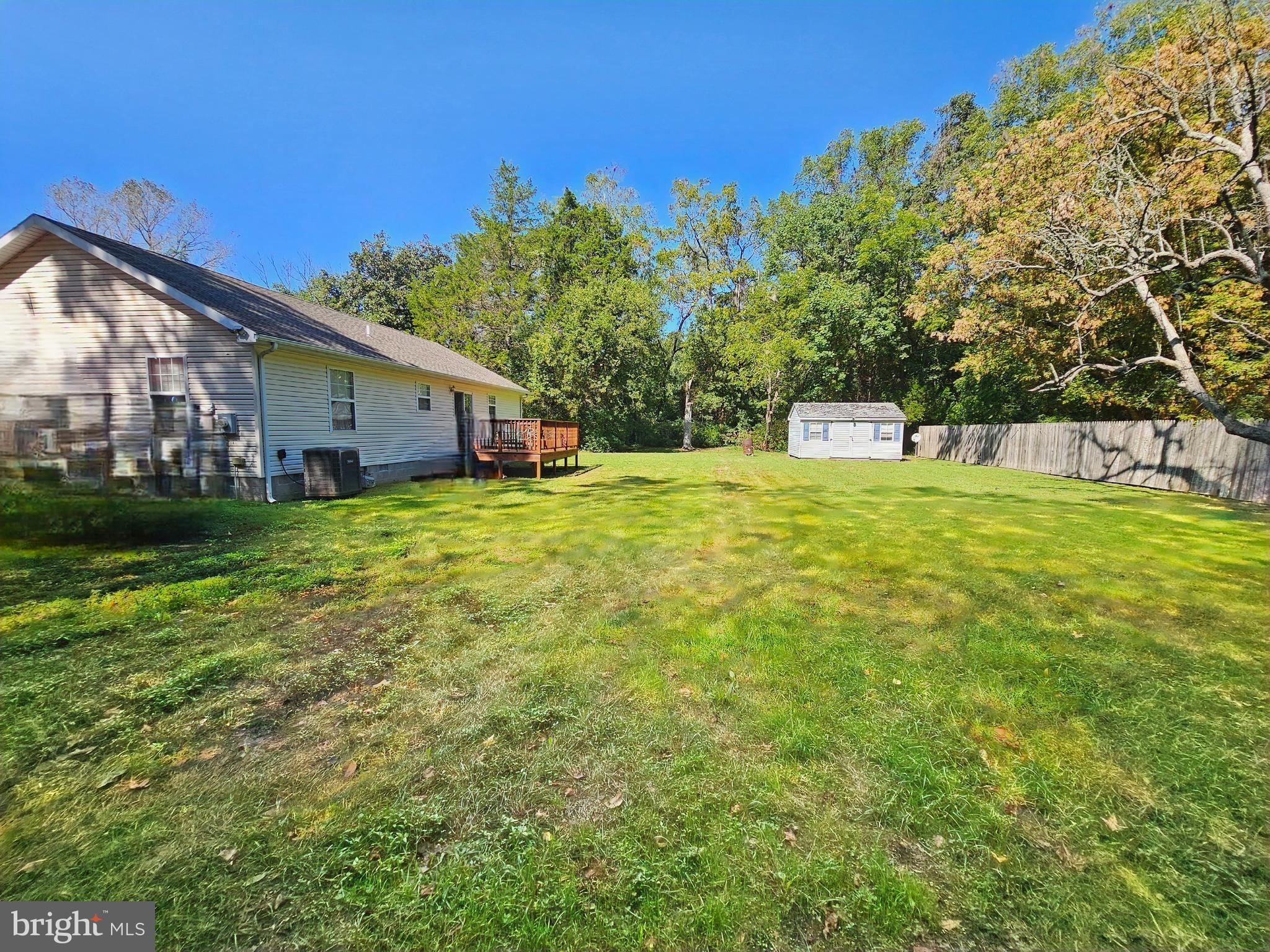 8339 Upper Hill Road Westover, MD 21871 - Photo 17 of 20 a white house with a big yard and large trees