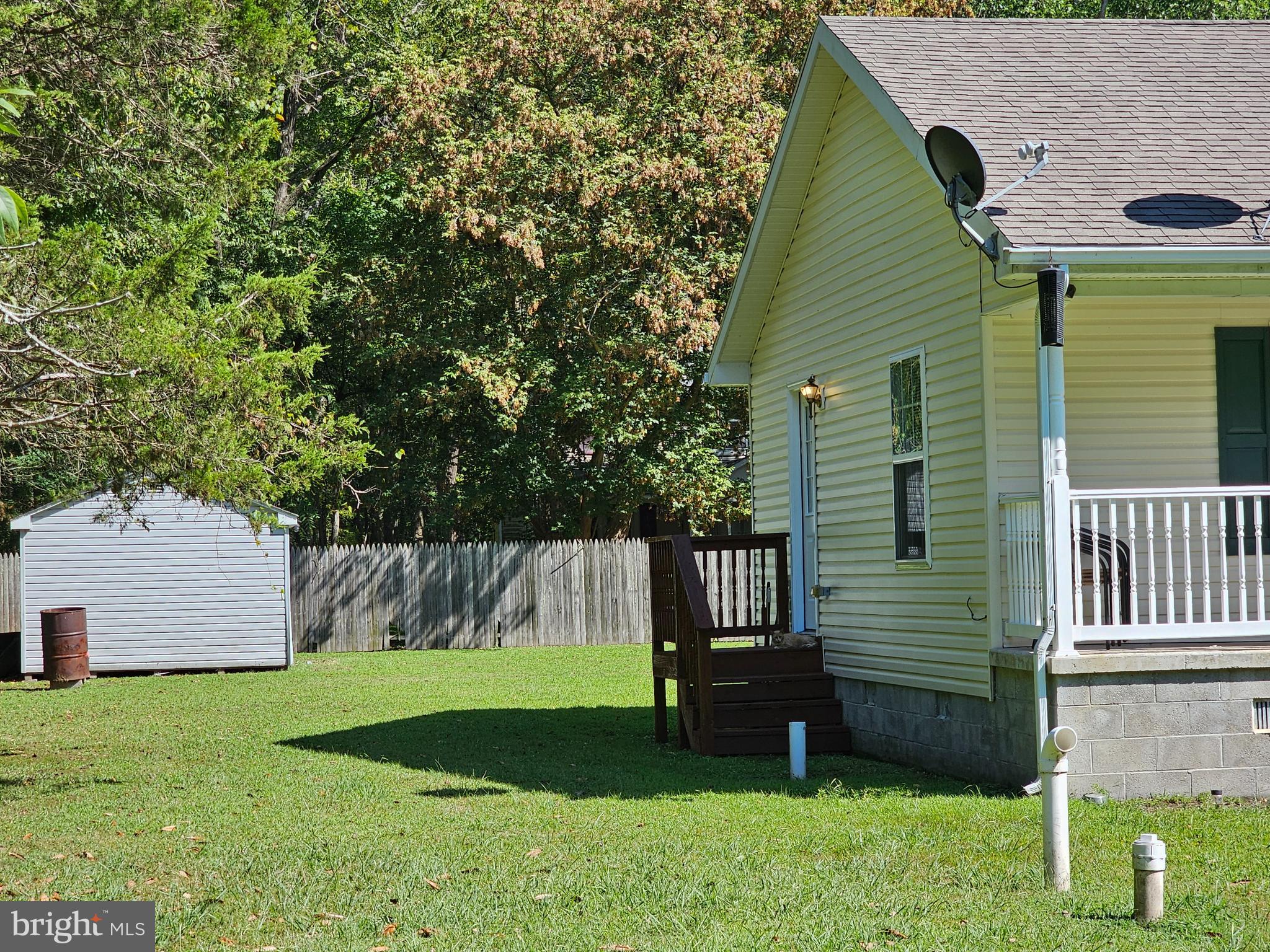 8339 Upper Hill Road Westover, MD 21871 - Photo 20 of 20 a view of a backyard with a large tree