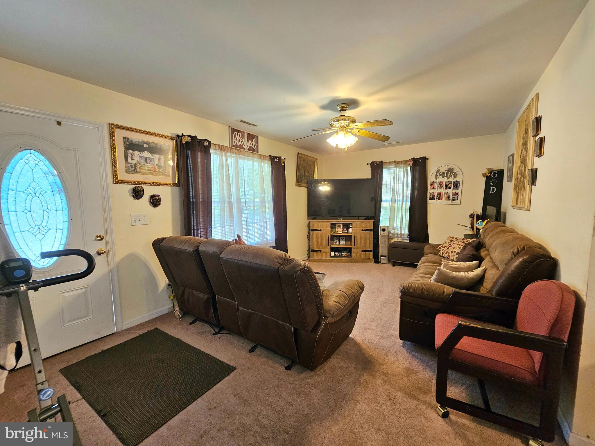 8339 Upper Hill Road Westover, MD 21871 - Photo 2 of 20 a living room with furniture and a chandelier