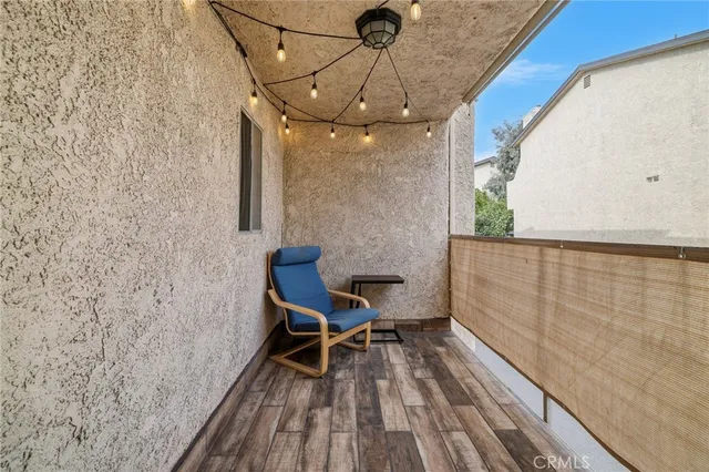 a view of a balcony with chairs