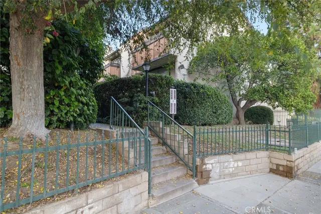 a view of house with wooden deck and floor