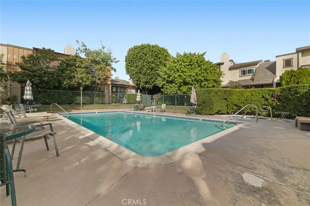 a view of a swimming pool with a patio