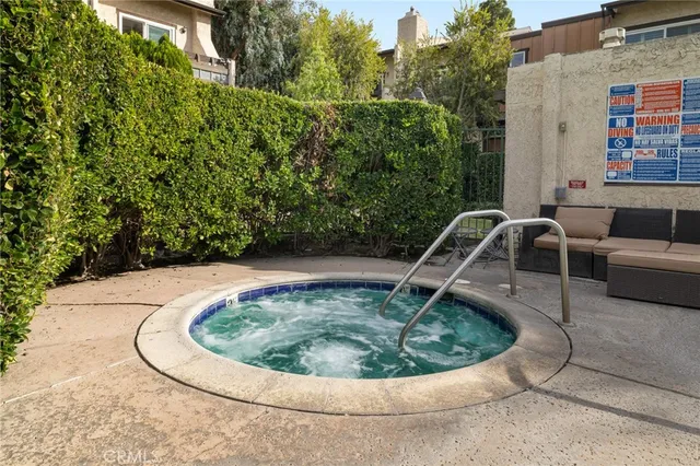 a view of a swimming pool with a outdoor seating