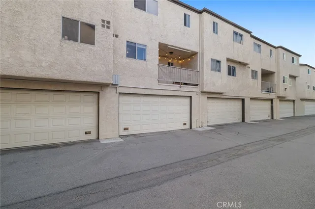 a view of building with garage