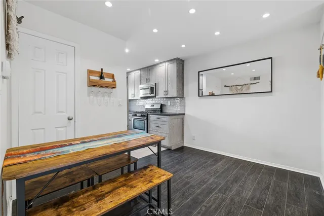 a room with wooden floor and table