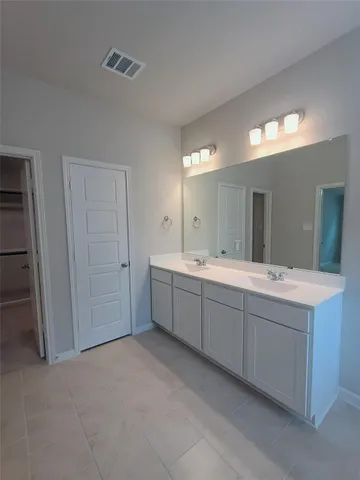 a bathroom with a sink a toilet and a bathtub