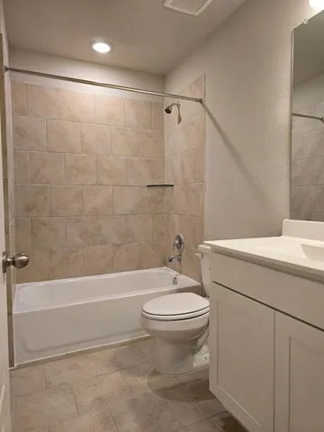 a view of a room with wooden floor and a small space