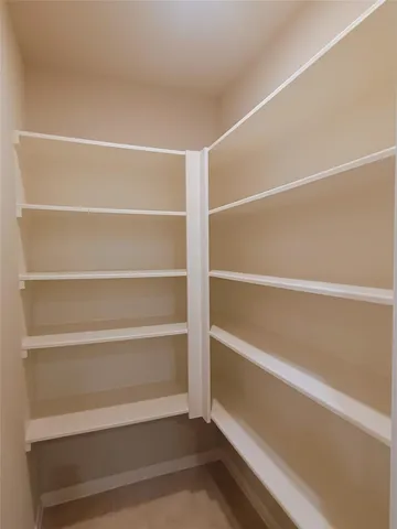 a spacious bathroom with a bathtub and shower