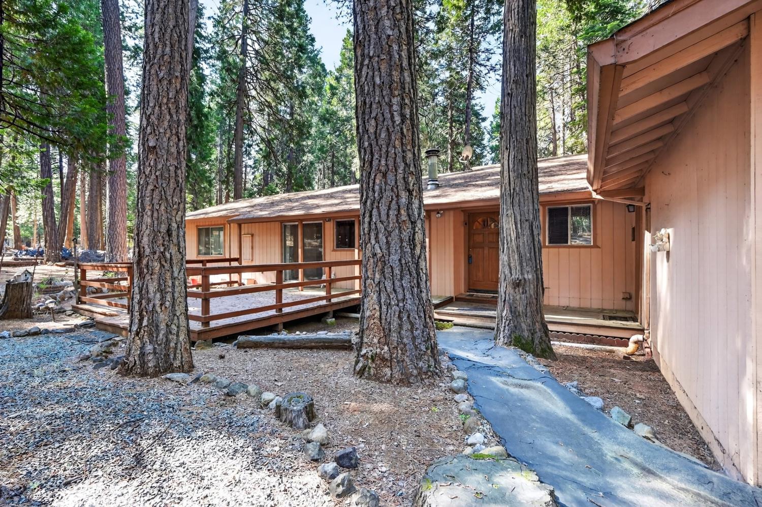 20191 Kit Court Volcano, CA 95689 - Photo 8 of 54 a front view of a house with a yard and balcony
