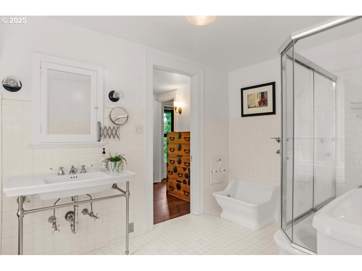 1965 Southwest Montgomery Place Portland, OR 97201 - Photo 34 of 48 a bathroom with a sink mirror toilet and shower