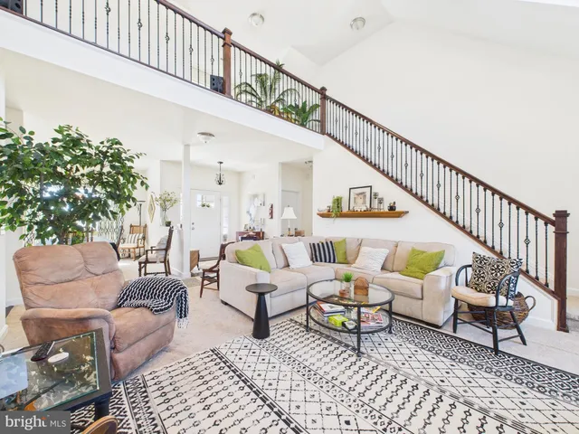 a living room with furniture and a rug