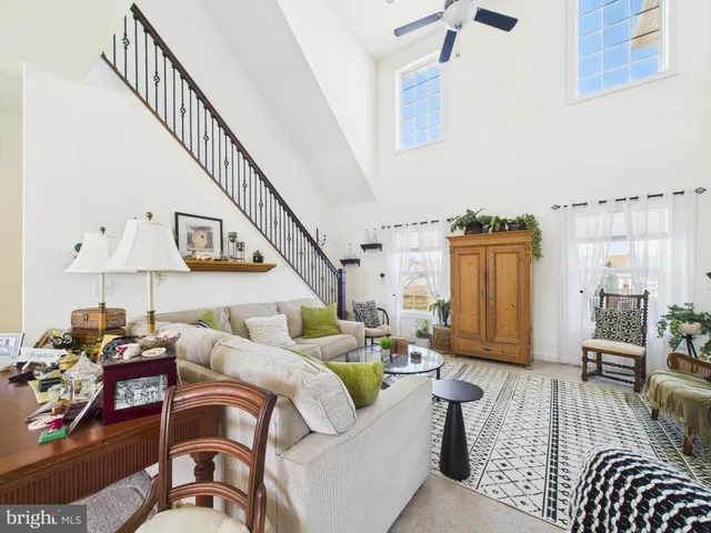 a living room with furniture or couch and a wooden floor