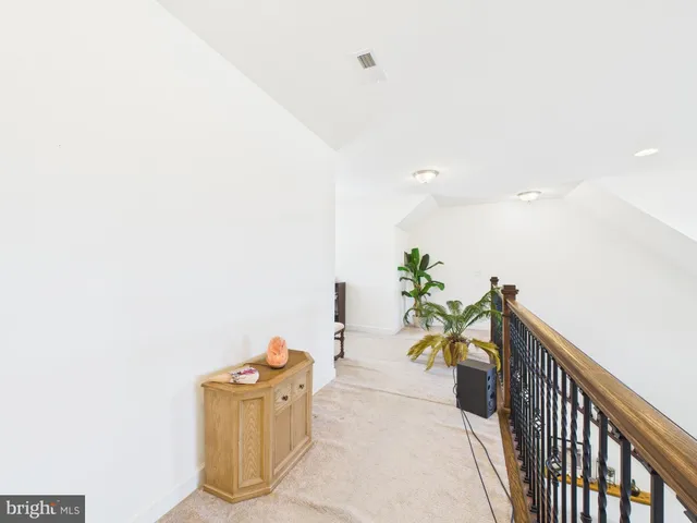 a large white bed in a white room