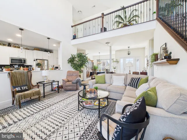 a living room with furniture and a rug