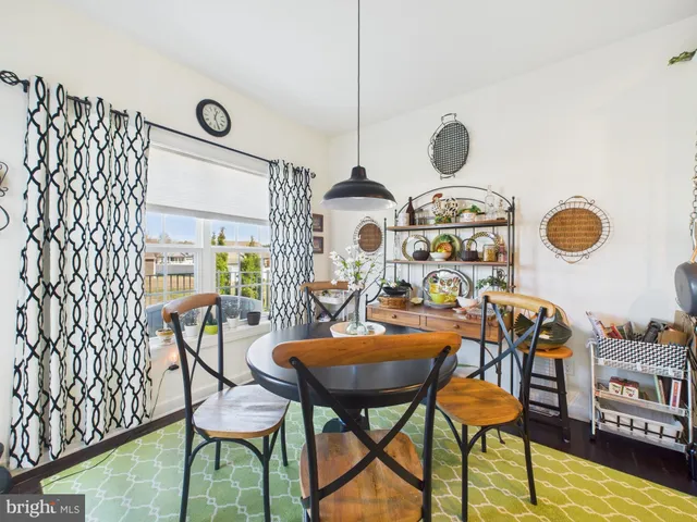 a view of a room with furniture and a chandelier