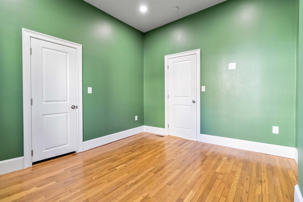51 Mansfield Street, Unit 51 Everett, MA 02149 - Photo 13 of 19 a view of an empty room with wooden floor