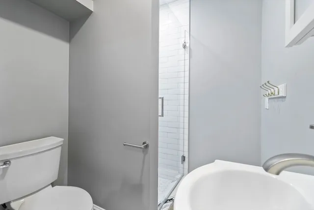 a bathroom with a toilet and a sink