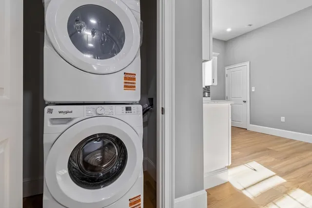 a view of a hallway with washer and dryer