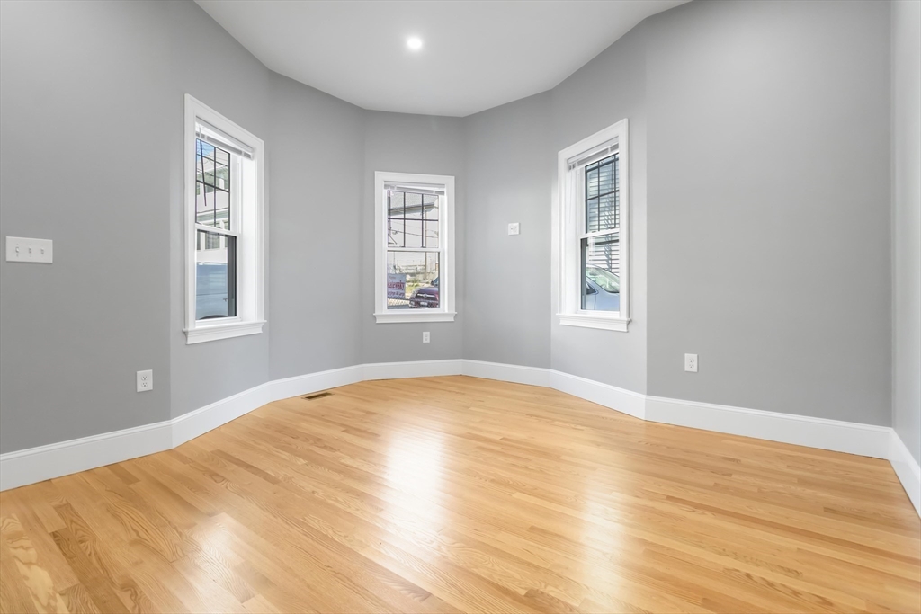 51 Mansfield Street, Unit 51 Everett, MA 02149 - Photo 6 of 19 a view of empty room with wooden floor and fan
