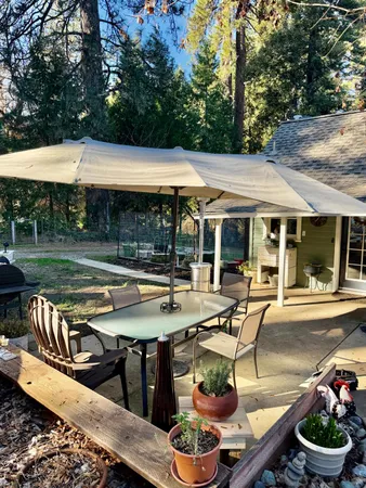 a patio with a table and chairs