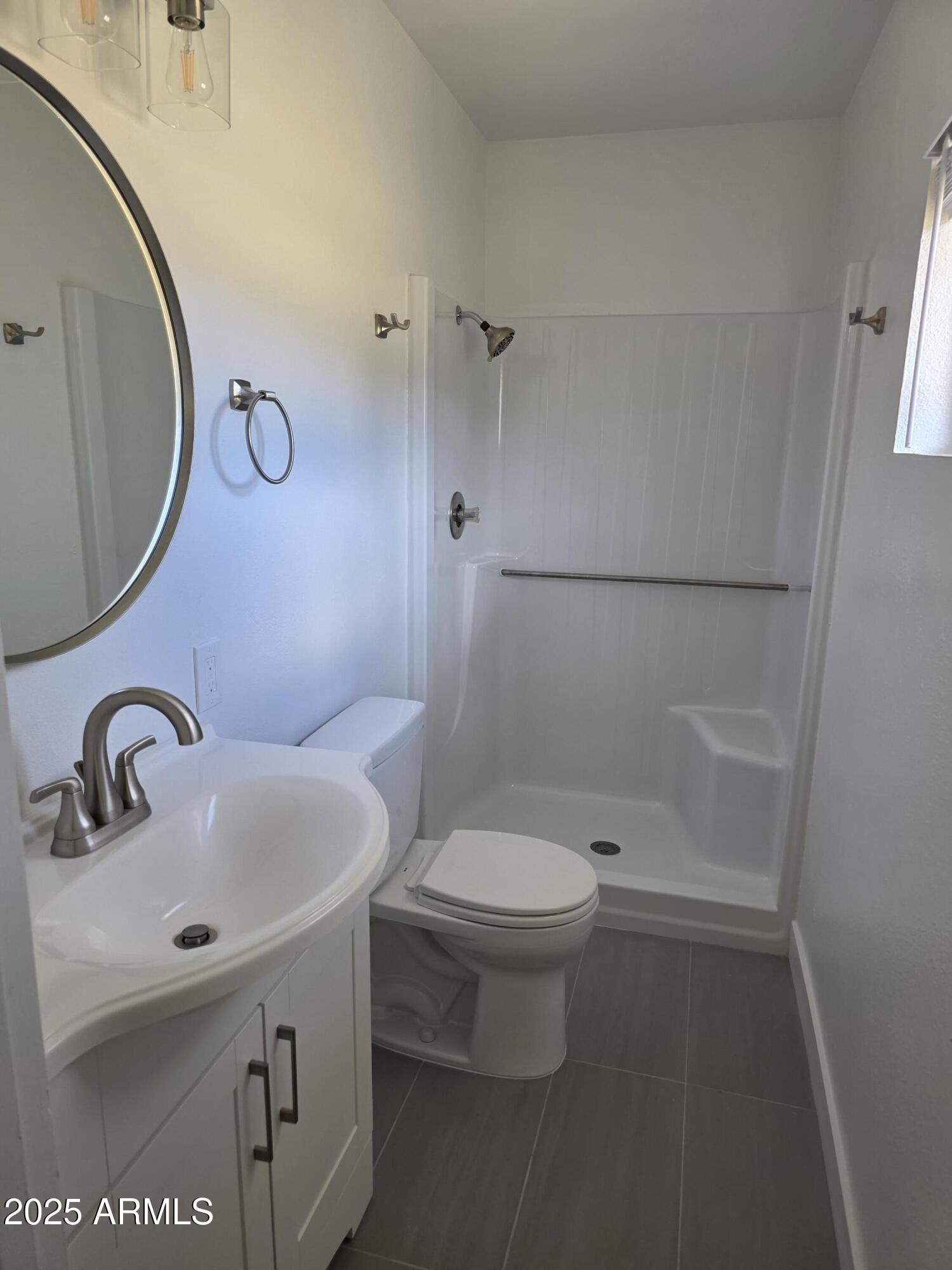 731 Elm Lane Eagar, AZ 85925 - Photo 12 of 26 a bathroom with a sink toilet and shower
