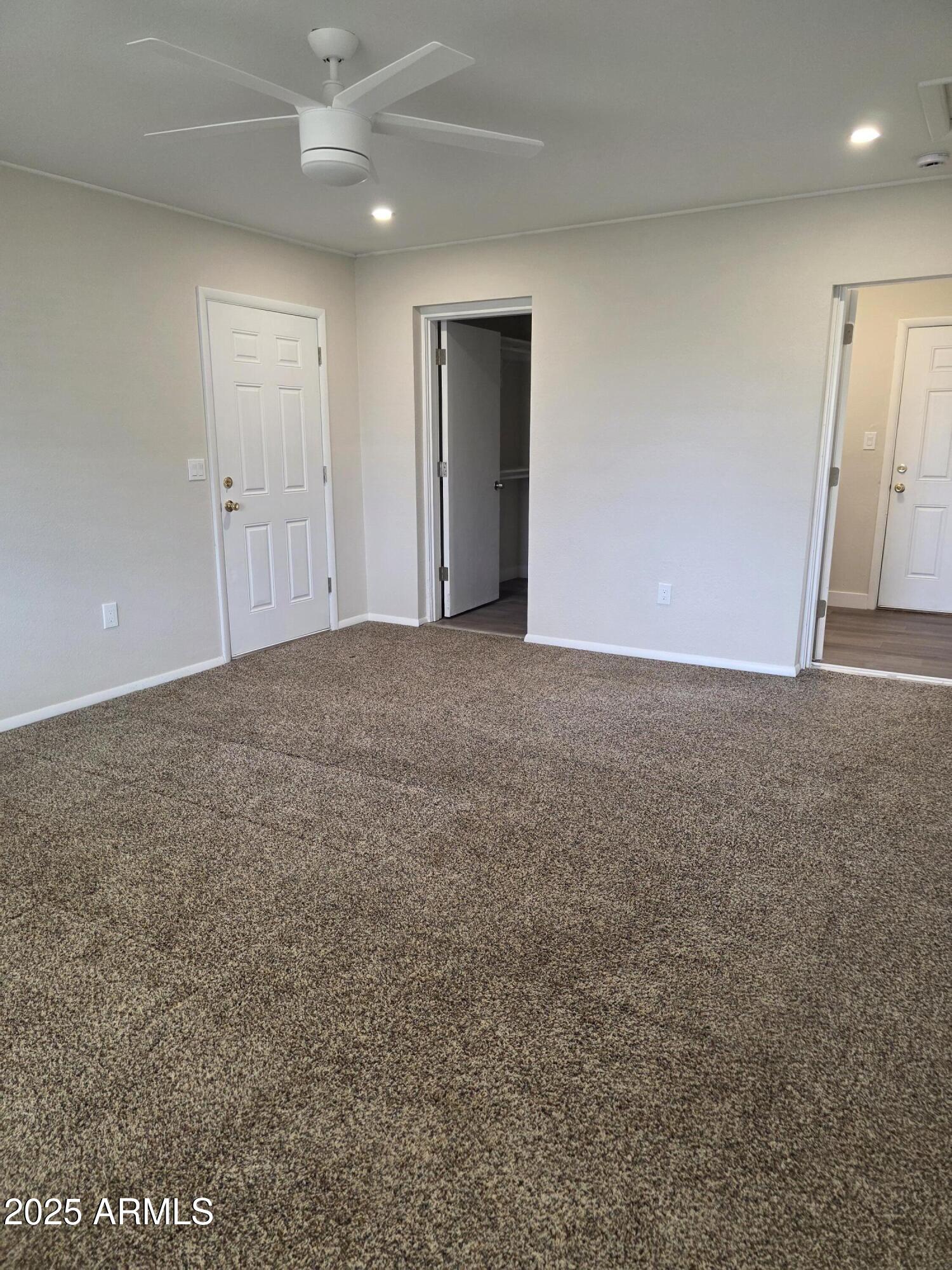 731 Elm Lane Eagar, AZ 85925 - Photo 18 of 26 an empty room with an entryway and fan