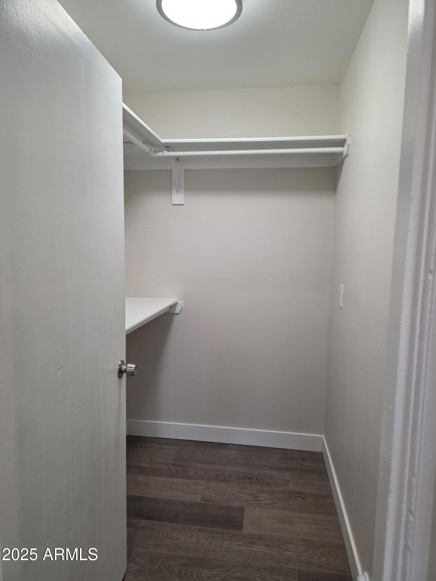 731 Elm Lane Eagar, AZ 85925 - Photo 19 of 26 a view of a room with wooden floor