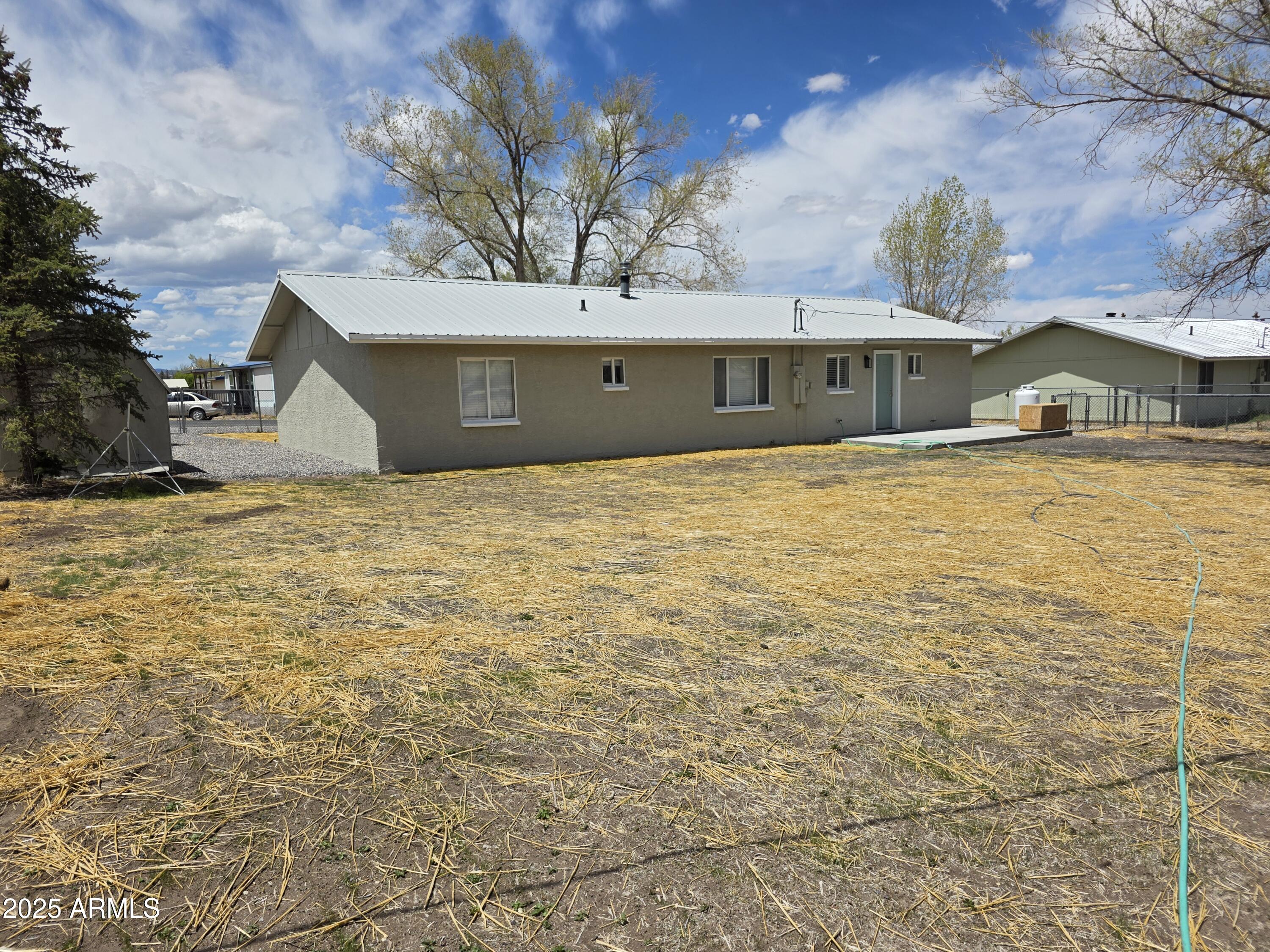 731 Elm Lane Eagar, AZ 85925 - Photo 23 of 26 a view of a house with a yard