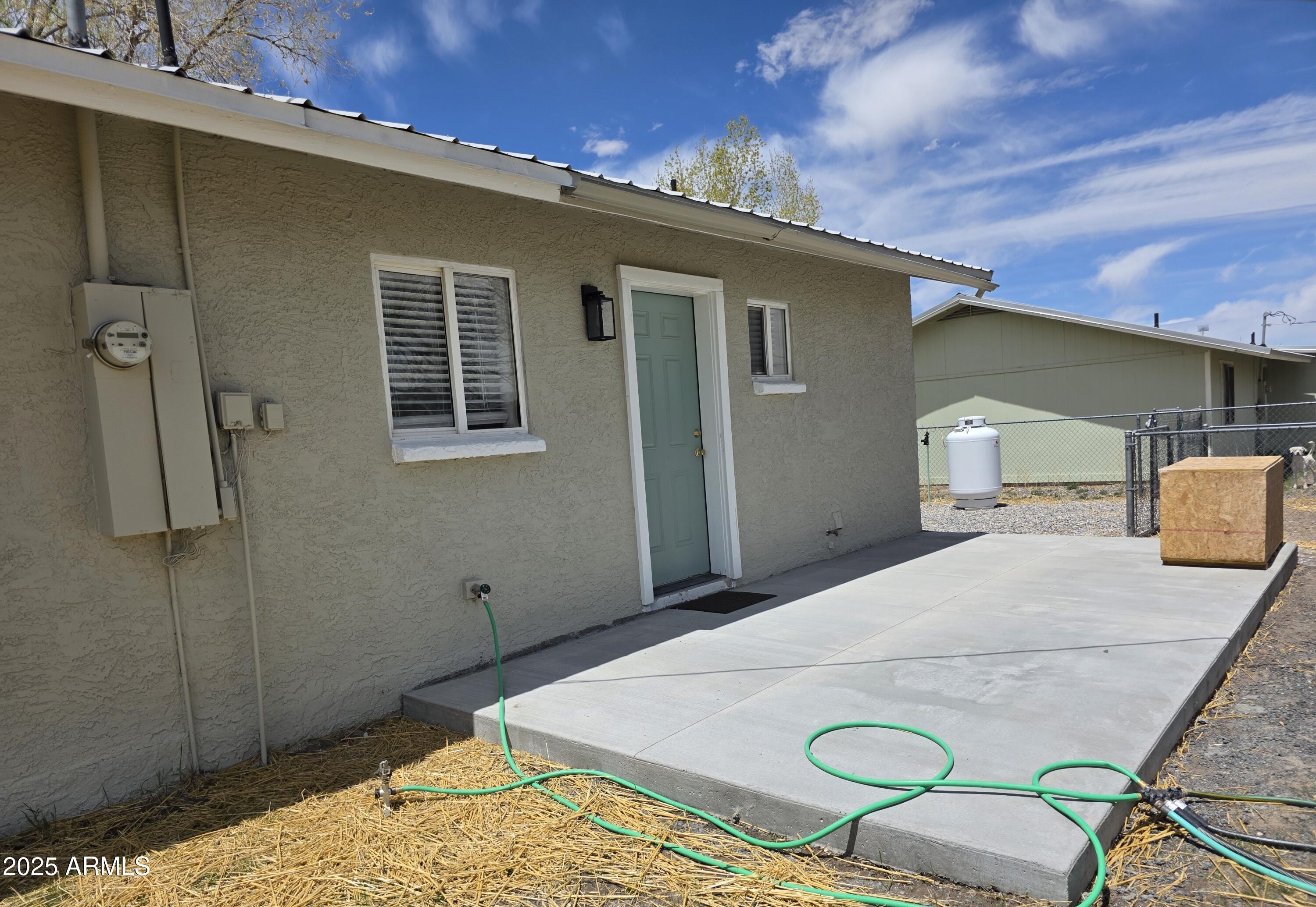 731 Elm Lane Eagar, AZ 85925 - Photo 26 of 26 a bedroom with a bed and dresser