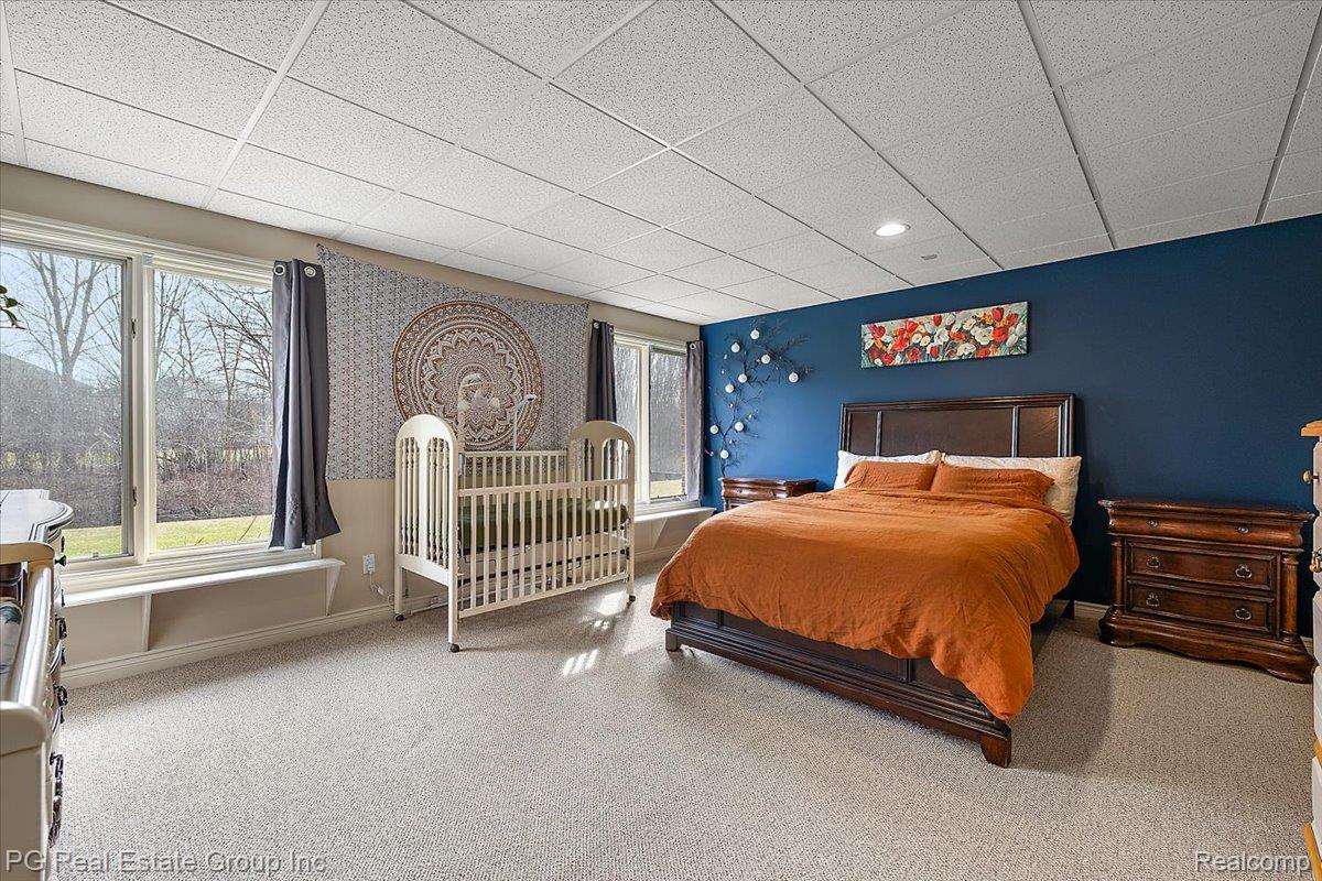 3571 Cedar Brook Drive Rochester, MI 48309 - Photo 53 of 57 Bedroom featuring light colored carpet, a paneled ceiling, and wallpapered walls