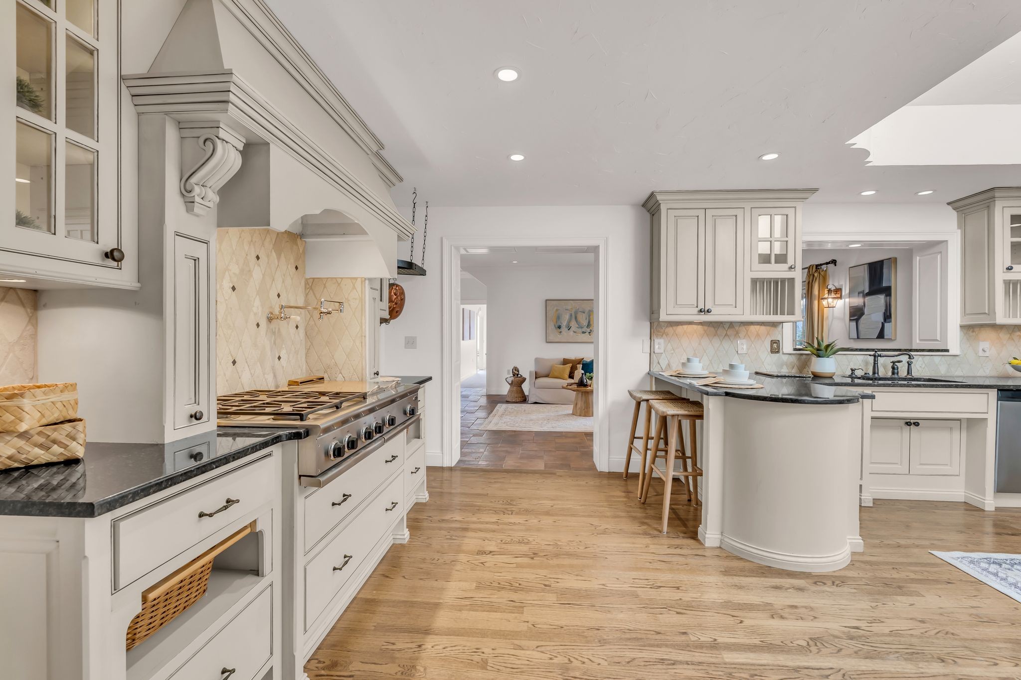 6307 Ramsgate Court Brentwood, TN 37027 - Photo 16 of 99 a large kitchen with stainless steel appliances a stove a sink dishwasher and a refrigerator with wooden floor