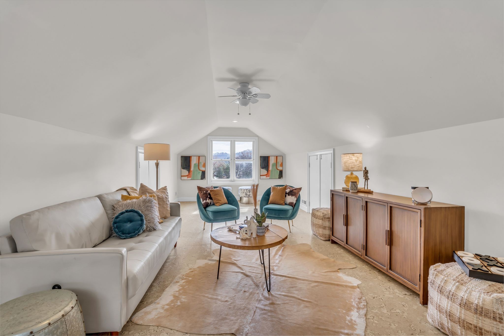 6307 Ramsgate Court Brentwood, TN 37027 - Photo 57 of 99 a living room with furniture a chandelier and a rug