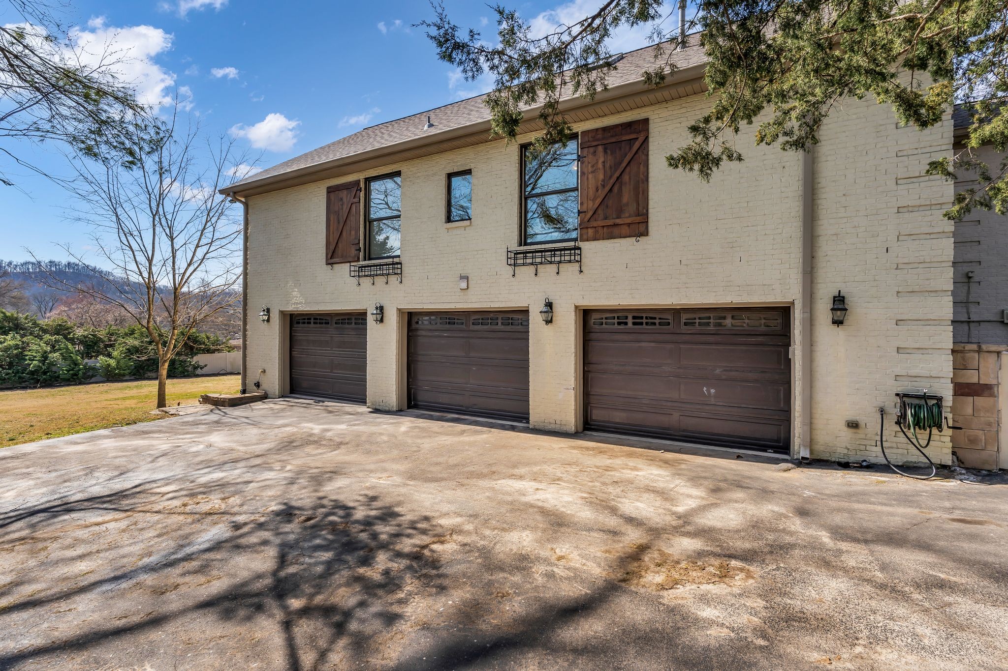6307 Ramsgate Court Brentwood, TN 37027 - Photo 82 of 99 a view of a house with a yard and garage