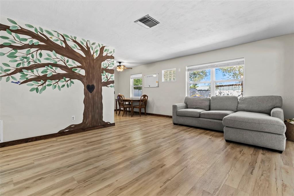 6221 Dalton Street Spring Hill, FL 34606 - Photo 11 of 40 a living room with furniture and a large window