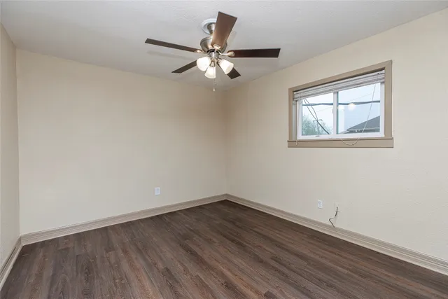 a bathroom with a shower and a window
