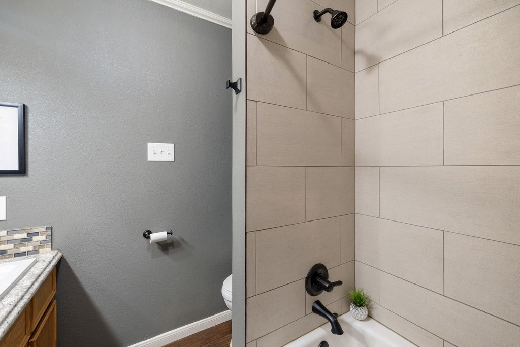 302 South Schramm Road Granger, TX 76530 - Photo 21 of 33 a bathroom with a sink